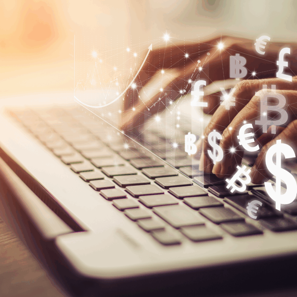 Hands typing on laptop with currency symbols for mastering personal finances