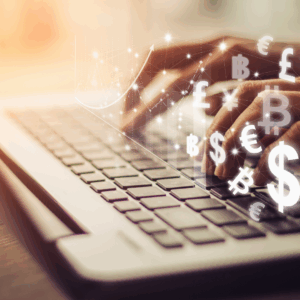 Hands typing on laptop with currency symbols for mastering personal finances