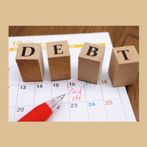 blocks on top of calendar that says debt, on the calendar a number is circled to show when the debt is paid off. It's to say habits to stay out of debt