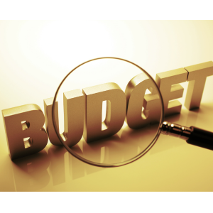 Magnifying glass over the word 'BUDGET' for how to create a budget