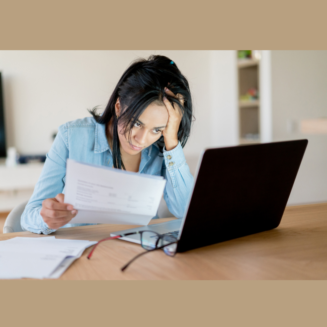 a woman looking through her bill for help prioritizing bills when you can't pay everything