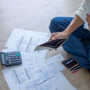 Person managing bills and finances.
