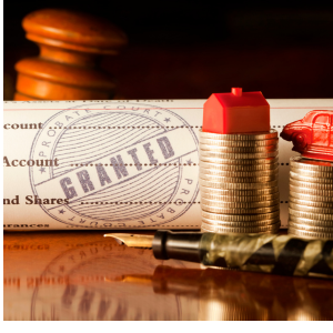 Legal documents with coins and gavel