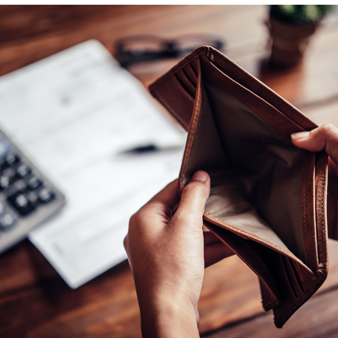 a person with an empty wallet for a money habit that ruins your finances